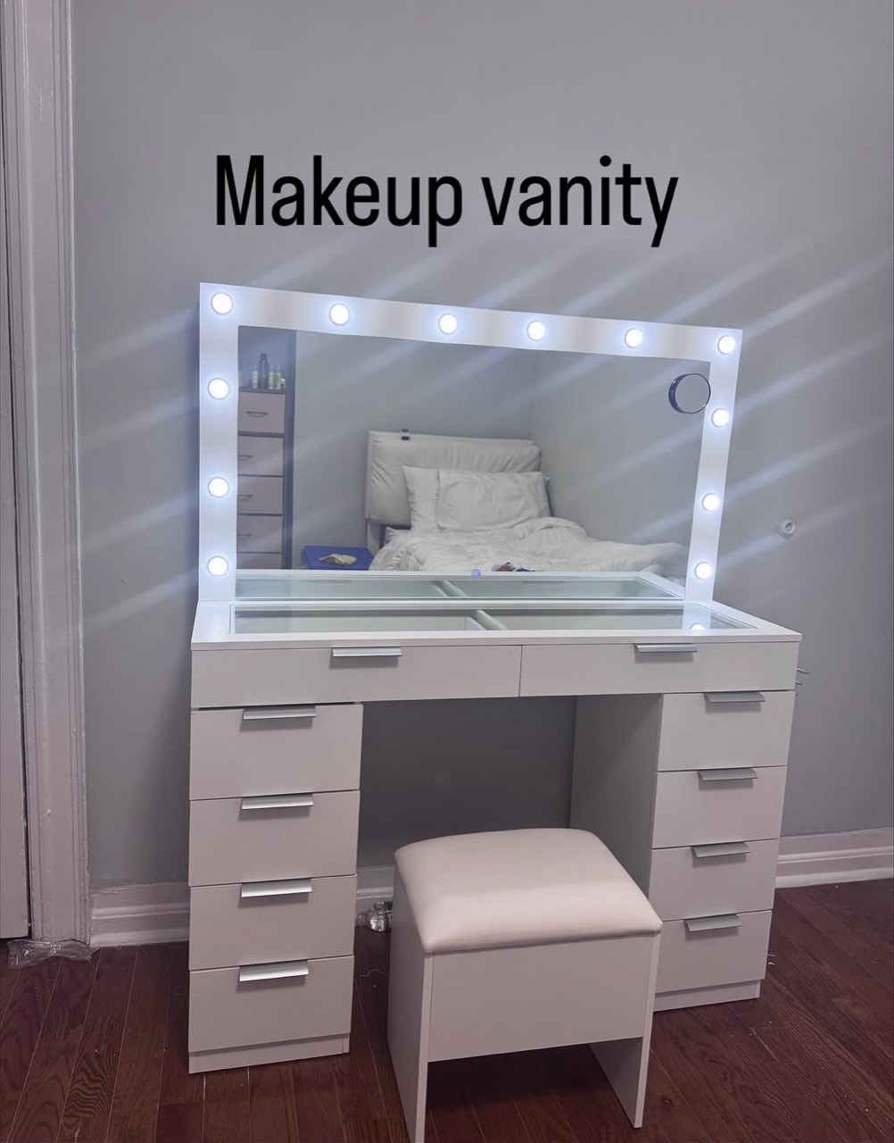 Completed white makeup vanity with lighted mirror