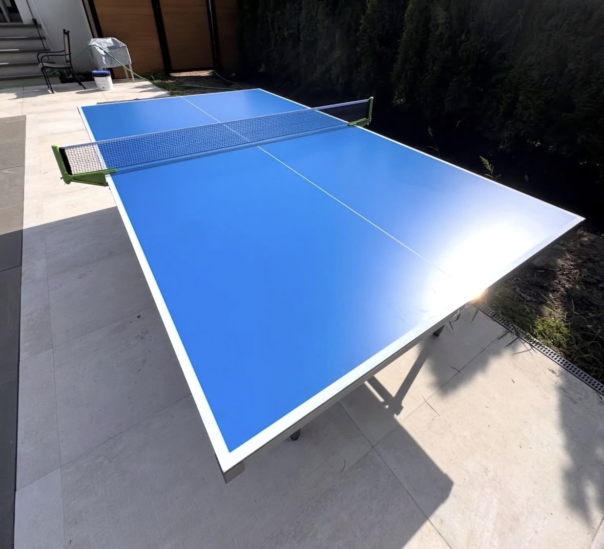 Completed blue outdoor ping-pong table