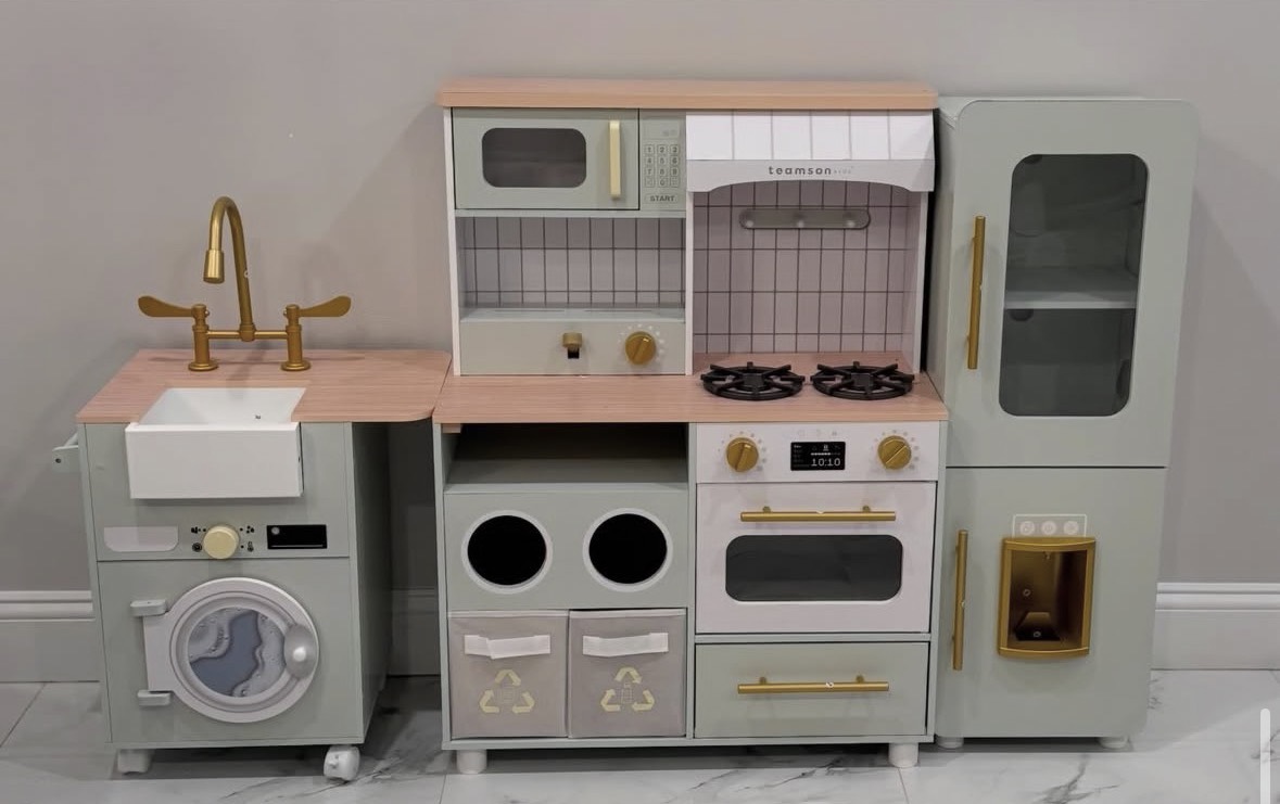 Completed pink and gold children's toy kitchen