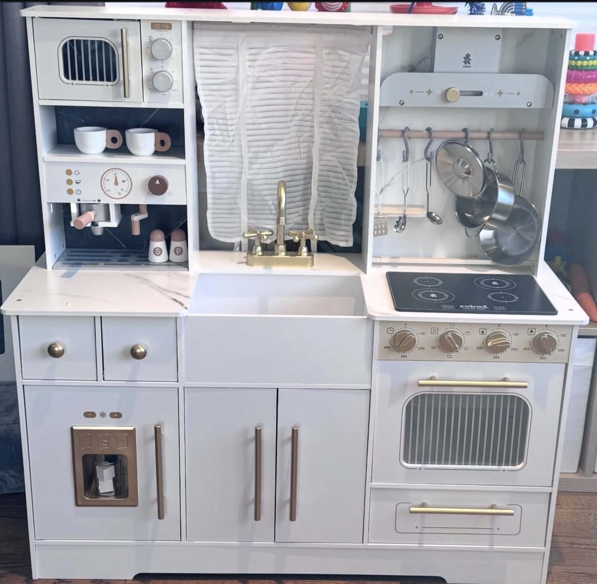 Completed white and gold children's toy kitchen